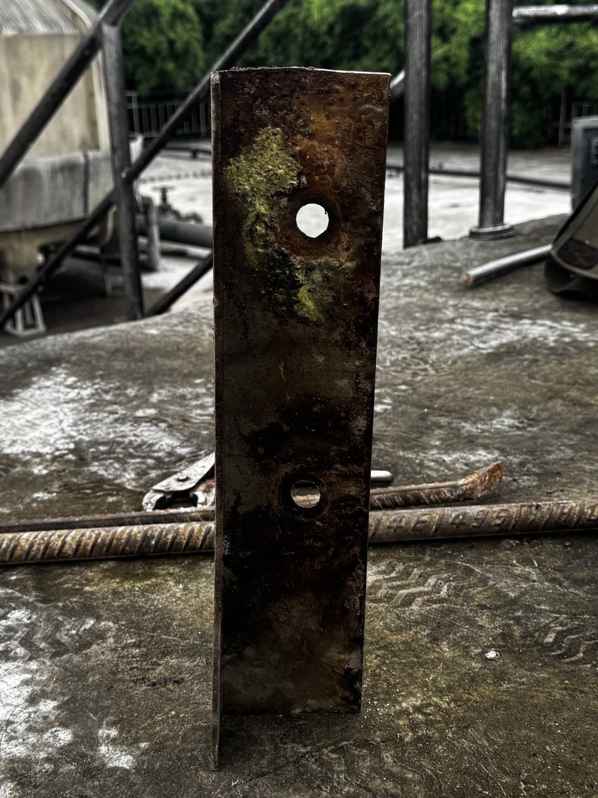 Removed clamping channel with visible corrosion