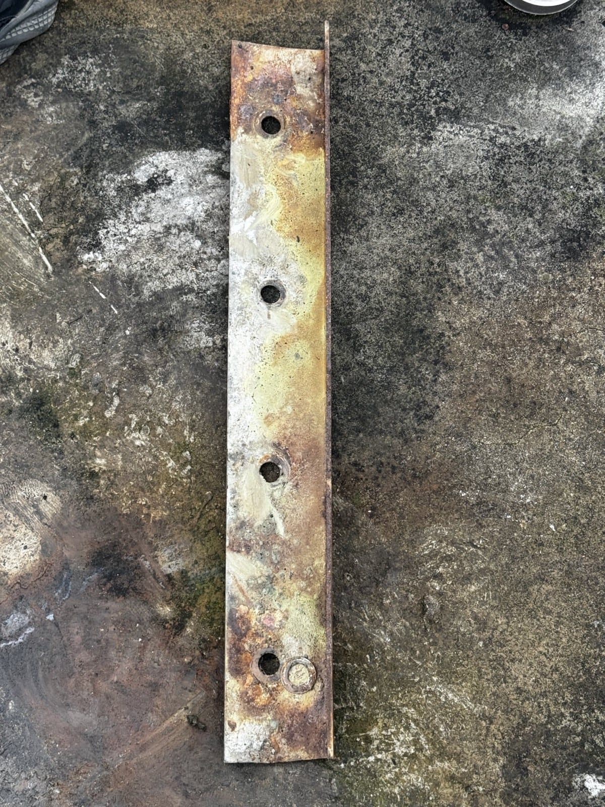 Removed pressure bar and bolt holes under inspection